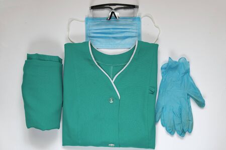medical uniform set folded on an isolated background nurseの写真素材