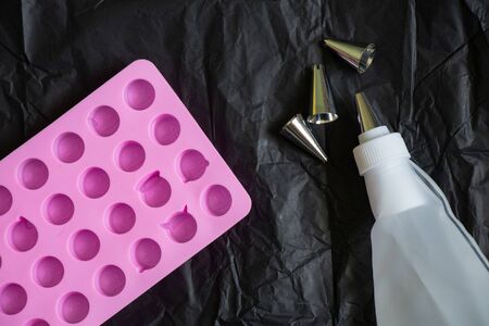 pastry bag and nozzles on the kitchen on the tableの写真素材
