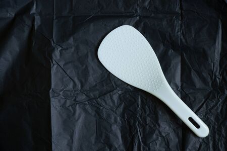 white spoon for multicooker on a blackの写真素材