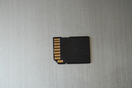 memory card drive lies on a steel gray backgroundの写真素材