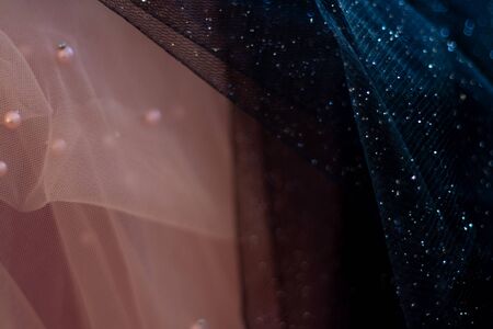 black-pink fabric with sparkles as a background