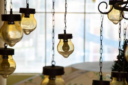 old vintage chandelier hanging on the ceiling of a hotel in egypt close-upの写真素材
