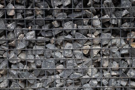 stone fence gabion close up daytime outdoorsの写真素材