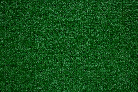 green artificial grass background as backgroundの写真素材