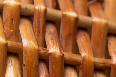 wicker basket of branches macro on an isolated backgroundの写真素材