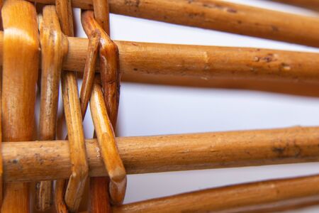 wicker basket of branches macro on an isolated backgroundの写真素材