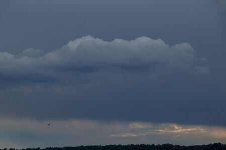 thunderclouds at sunset over the Dnieper riverの写真素材