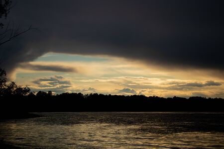 thunderclouds at sunset over the Dnieper riverの写真素材