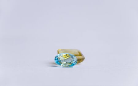 Close-up of a collection of precious multi-colored stones on a white backgroundの写真素材