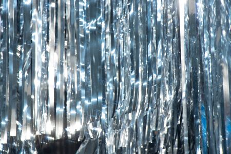 thin sliced strips of foil as a backgroundの写真素材