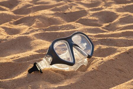 mask for diving lies sand in egypt close up in the sunの写真素材