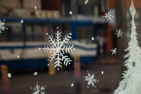 painted snowflake on a window in winter