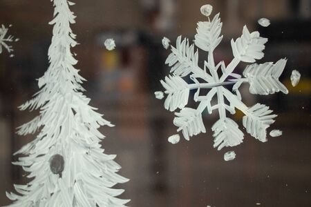 painted snowflake on a window in winterの写真素材
