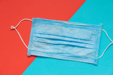 medical mask on red-blue background