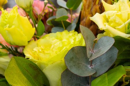a bouquet of eustoma flowers lies on a tableの写真素材
