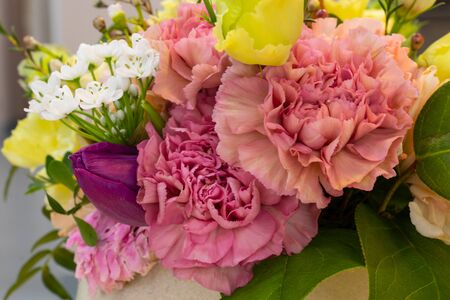 a bouquet of eustoma flowers lies on a tableの写真素材