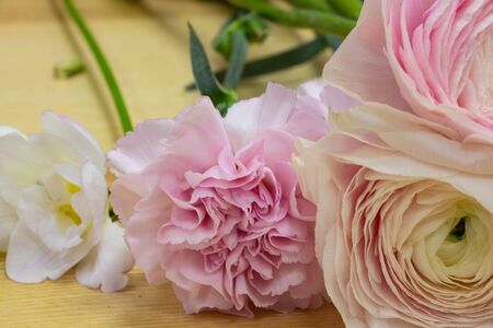 a bouquet of eustoma flowers lies on a tableの写真素材