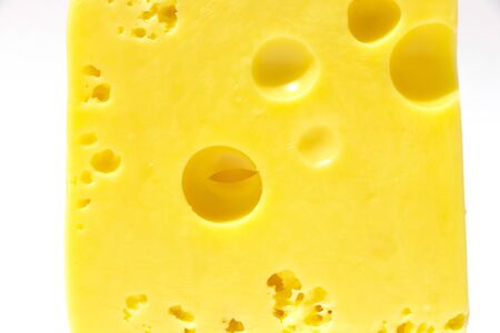piece of cheese on a white isolated backgroundの写真素材