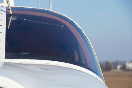 small old plane stands at the airport in the city of Dnieper on a sunny dayの写真素材