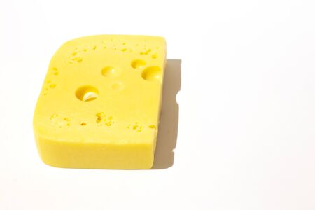 piece of cheese on a white isolated backgroundの写真素材