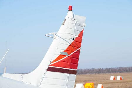 small old plane stands at the airport in the city of Dnieper on a sunny dayの写真素材