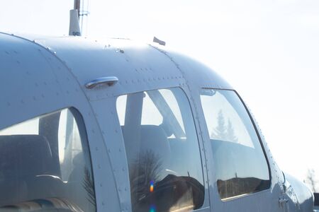 small old plane stands at the airport in the city of Dnieper on a sunny dayの写真素材