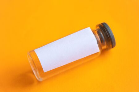 glass test tube with white blank label on an isolated