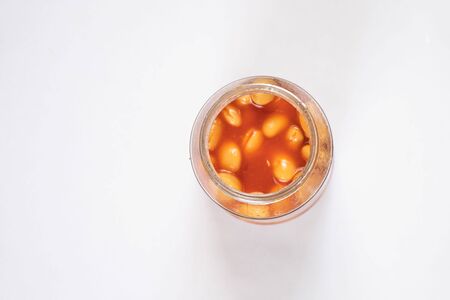 canned beans in a jar on a white plateの写真素材