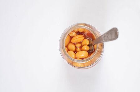 canned beans in a jar on a white plateの写真素材