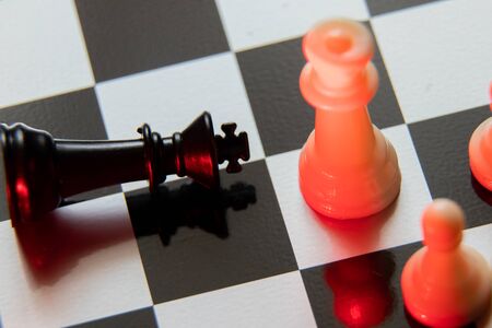chess pieces on a chessboard in the dark