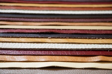 different colors pieces of leather as a background closeupの写真素材