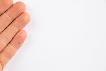 female hands of a young girl on a white background close-upの写真素材