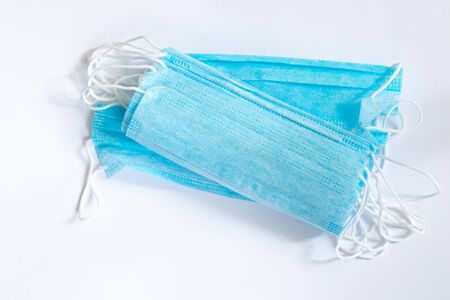 medical protective blue mask on a white background close-up