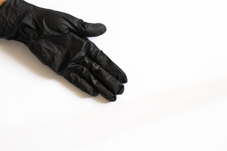 female hand in medical gloves on a white background