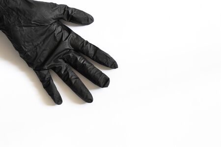 female hand in medical gloves on a white backgroundの写真素材