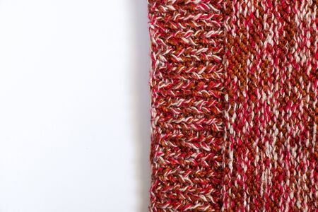 knitted multi-colored fabric sweaters on a white background