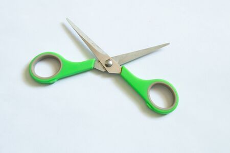 stationery scissors lie on an isolated backgroundの写真素材