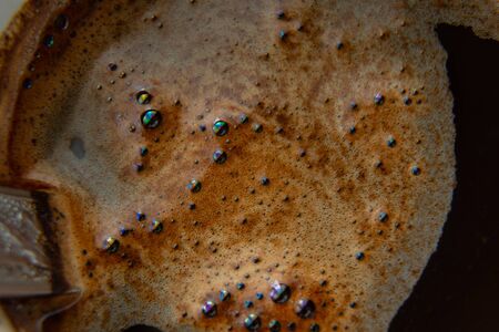 coffee foam in a cup of black coffee macroの写真素材