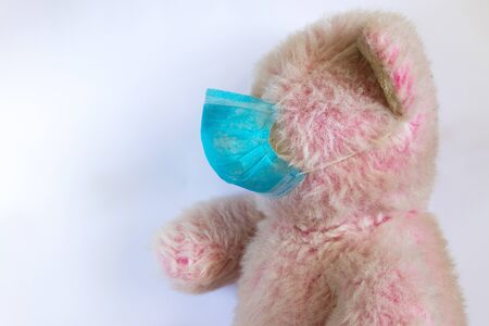 baby teddy bear masked medical closeup epidemicの写真素材