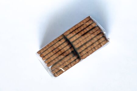 chocolate chip cookies in a stack on a white backgroundの写真素材
