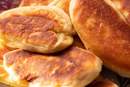 homemade fried pies with potatoes on a plateの写真素材