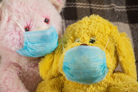 baby teddy bear masked medical closeup epidemicの写真素材