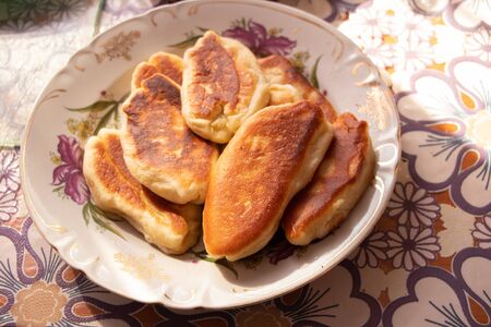 homemade fried pies with potatoes on a plateの写真素材