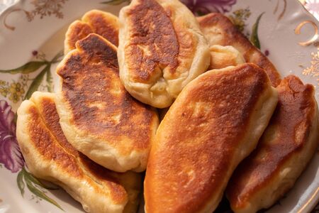 homemade fried pies with potatoes on a plateの写真素材