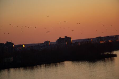 sunset over the Dnieper city in Ukraine in the eveningの写真素材