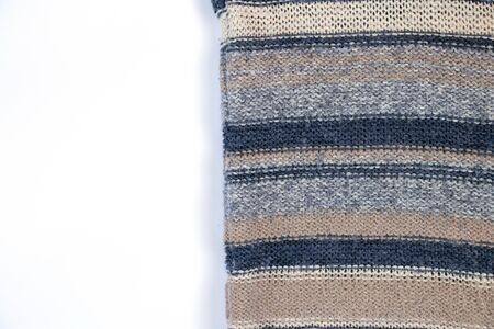 knitted multi-colored fabric sweaters on a white backgroundの写真素材
