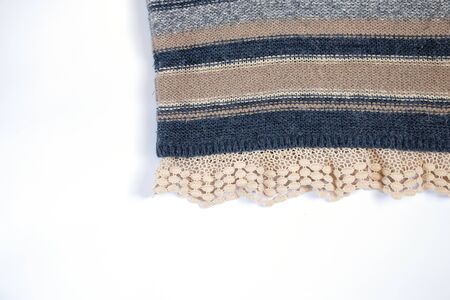 knitted multi-colored fabric sweaters on a white backgroundの写真素材
