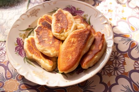 homemade fried pies with potatoes on a plateの写真素材