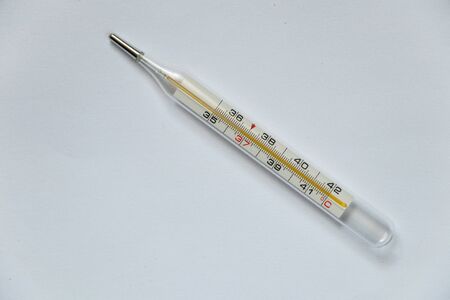 old alcohol glass thermometer on an isolated backgroundの写真素材
