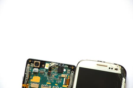 broken phone and disassembled phone nearbyの写真素材